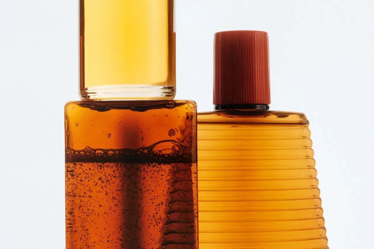 Amber glass product bottles styled in warm light